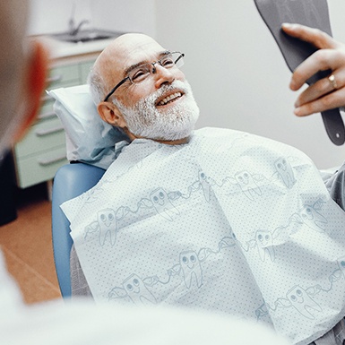 Patient smiling in the dental chair 