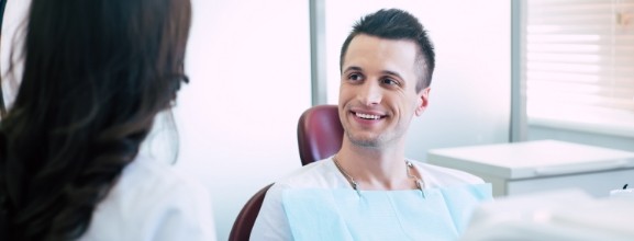 Man talking to dental team member
